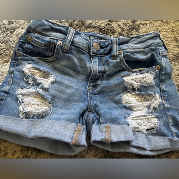 American Eagle Outfitters Pants - American Eagle Ripped medium wash jean shorts removable lace pockets Size: 4